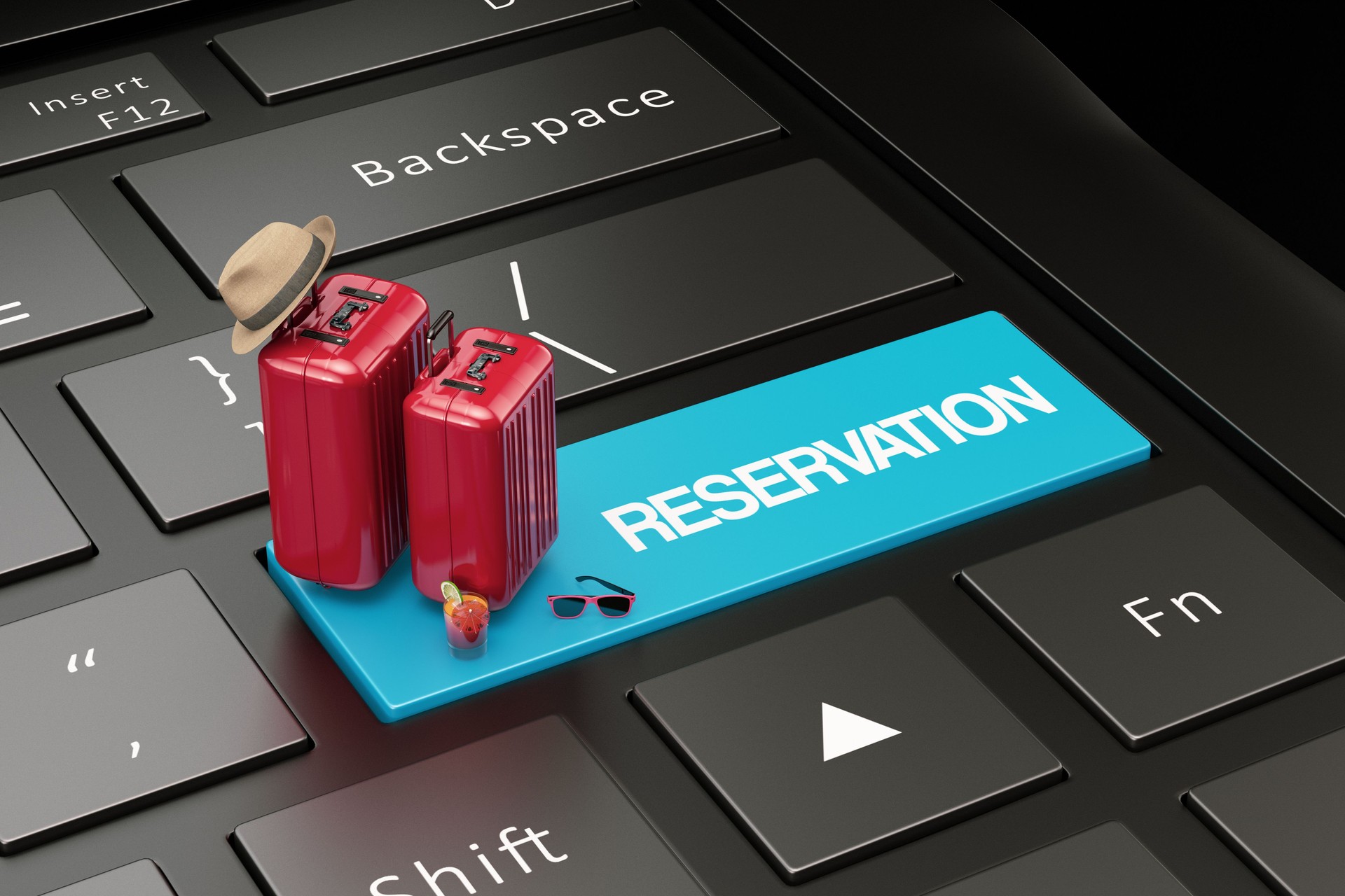 Concept de réservation en ligne avec valises et ordinateur portable